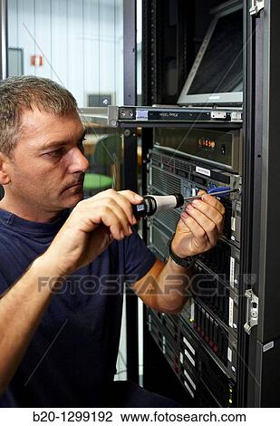 Man using screwdriver, compute cluster maintenance View Large Photo Image Stock Image - Man using screwdriver, compute cluster maintenance. Fotosearch