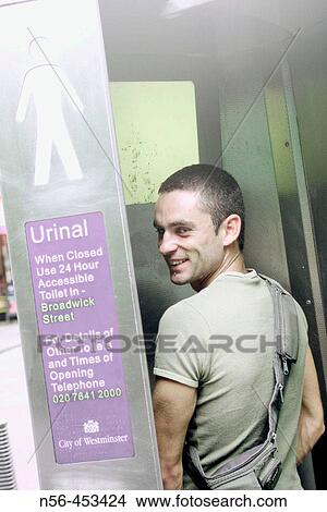 Man using urinal View Large Photo Image Picture - Man using urinal. Fotosearch