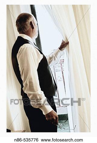 Man waiting and watching out window View Large Photo Image Stock Photograph - Man waiting and watching out window. Fotosearch