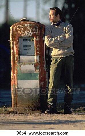 Man waiting at Gas Pump View Large Photo Image Picture - Man waiting at Gas Pump. Fotosearch