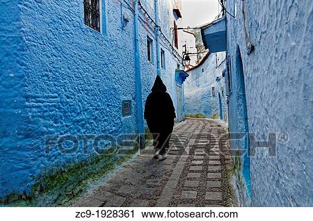 Man walking on the street, Chefchaouen, Rif region, Morocco View Large Photo Image Stock Image - Man walking on the street, Chefchaouen, Rif region, Morocco. Fotosearch