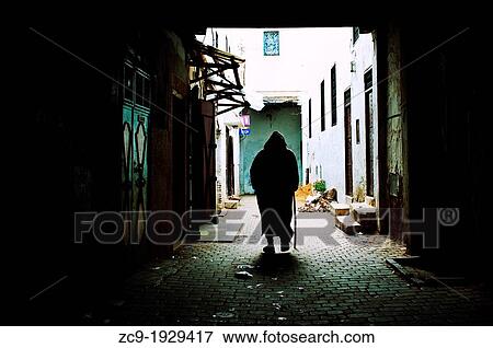 Man walking on the streets of Moulay Idriss medina. Morocco View Large Photo Image Stock Photo - Man walking on the streets of Moulay Idriss medina. Morocco. Fotosearch
