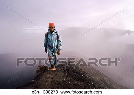 man walking on the top of the complex volcano Mount Merapi at dawn, Sumatra island, Republic of Indonesia, Southeast Asia and Oceania View Large Photo Image Stock Photo - man walking on the top of the complex volcano Mount Merapi at dawn, Sumatra island, Republic of Indonesia, Southeast Asia and Oceania. Fotosearch