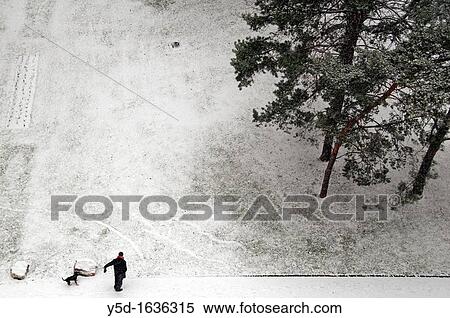 man walking out the dog, snowed street, winter in Geneva, Switzerland View Large Photo Image Stock Photography - man walking out the dog, snowed street, winter in Geneva, Switzerland. Fotosearch