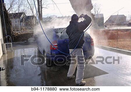 Stock Image - Man washing a car. Fotosearch