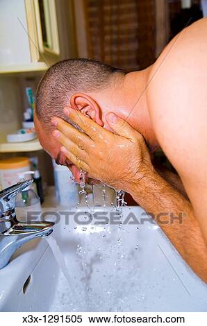 Man washing face in sink after shaving View Large Photo Image Stock Photography - Man washing face in sink after shaving. Fotosearch