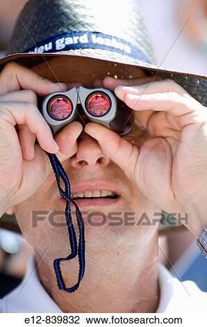 Man watching bullfight,? Feria de la Pentec? te?, N? mes. Gard, Languedoc-Roussillon, France View Large Photo Image Stock Image - Man watching bullfight,? Feria de la Pentec? te?, N? mes. Gard, Languedoc-Roussillon, France. Fotosearch