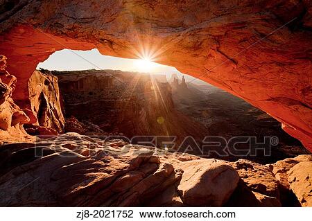 Man watching sunrise, mesa arch, Utah. View Large Photo Image Stock Image - Man watching sunrise, mesa arch, Utah.. Fotosearch
