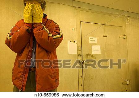 Man, wearing a heavy red jacket and thick yellow gloves, standing in front of an industrial freezer. View Large Photo Image Stock Photograph - Man, wearing a heavy red jacket and thick yellow gloves, standing in front of an industrial freezer.. Fotosearch