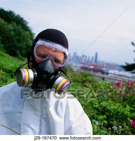 Man wearing a respiratory mask for organic vapors like asbestos, dust and particulate aerosols View Large Photo Image Stock Image - Man wearing a respiratory mask for organic vapors like asbestos, dust and particulate aerosols. Fotosearch