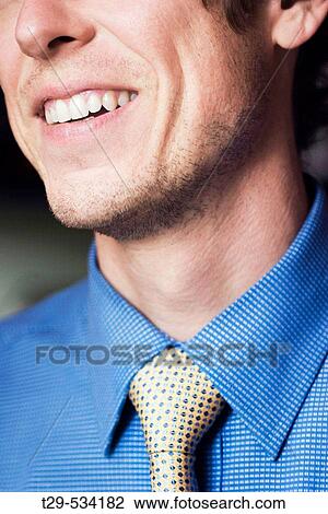 Man wearing a shirt and tie View Large Photo Image Stock Image - Man wearing a shirt and tie. Fotosearch