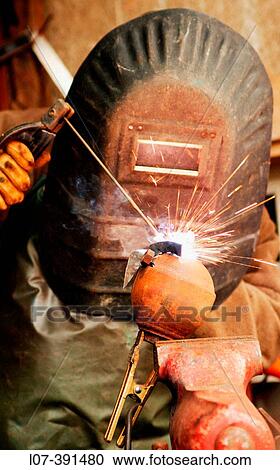 Man wearing mask and welding iron. Lurcy-Levis. France View Large Photo Image Stock Image - Man wearing mask and welding iron. Lurcy-Levis. France. Fotosearch