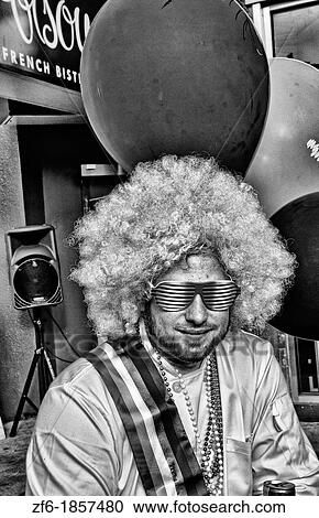 Stock Image - Man wearing poink in Gay Pride Weekend Pink Celebration in the gay Castro District of San Francisco California. Fotosearch