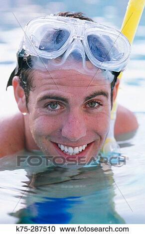 Stock Image - man wearing snorkel gear. Fotosearch
