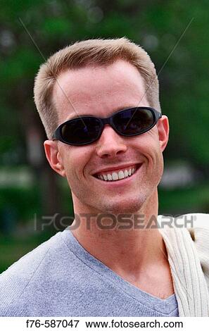 Man wearing sunglasses. View Large Photo Image Stock Photo - Man wearing sunglasses.. Fotosearch