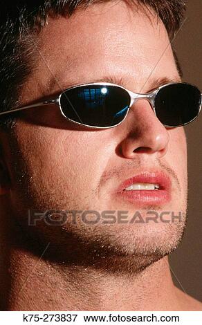 Man wearing sunglasses View Large Photo Image Stock Photo - Man wearing sunglasses. Fotosearch
