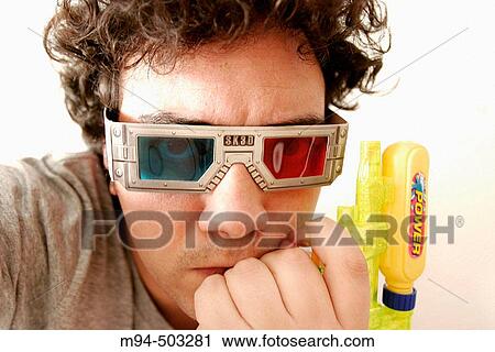 Man with 3D glasses and a water gun. View Large Photo Image Stock Image - Man with 3D glasses and a water gun.. Fotosearch