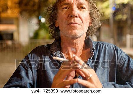 Man with a cigarette, Cours Julien, Marseille, France View Large Photo Image Stock Image - Man with a cigarette, Cours Julien, Marseille, France. Fotosearch