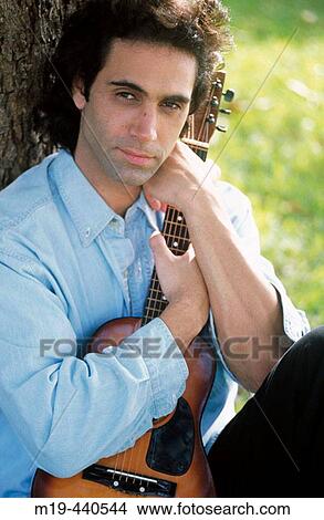 Picture - man with a guitar. Fotosearch