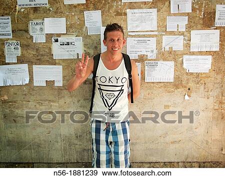Stock Photo - Man with ads on the wall. Fotosearch