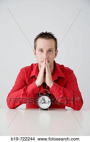 Man with alarm clock View Large Photo Image Picture - Man with alarm clock. Fotosearch