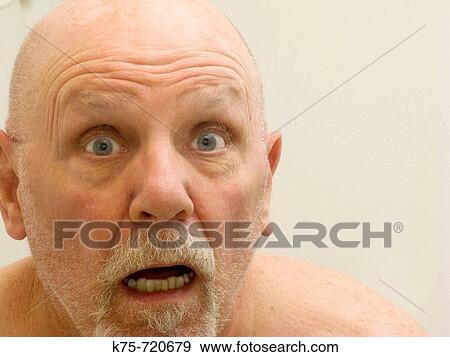 Stock Photo - Man with an amazed look on his face. Fotosearch