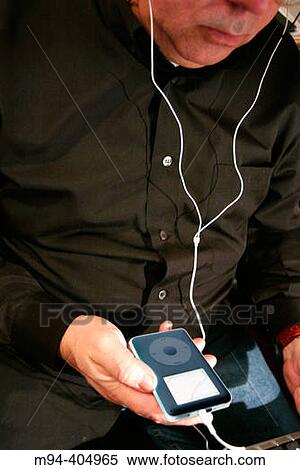 Man with an Ipod. View Large Photo Image Stock Photography - Man with an Ipod.. Fotosearch