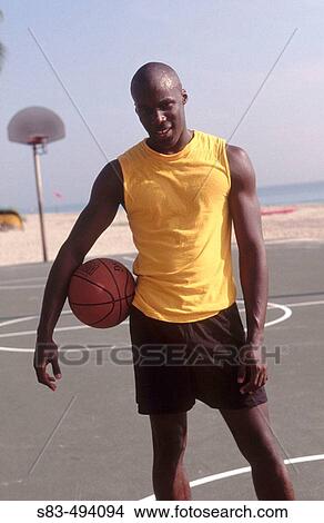 Man with basketball View Large Photo Image Picture - Man with basketball. Fotosearch