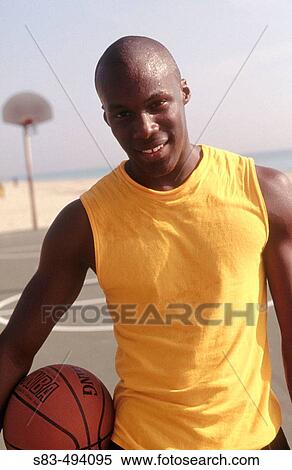 Man with basketball View Large Photo Image Stock Photography - Man with basketball. Fotosearch