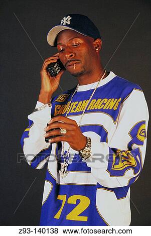 Stock Photo - Man with beeper and cell phone. Fotosearch