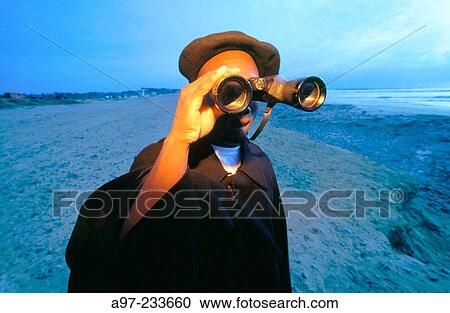 Stock Image - Man with binoculars. Fotosearch