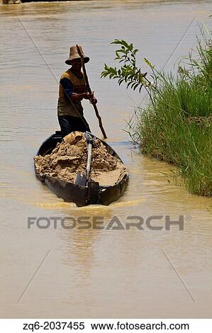 Man with Boat on the Diamond Fields of Cempaka, Indonesia. View Large Photo Image Stock Photography - Man with Boat on the Diamond Fields of Cempaka, Indonesia.. Fotosearch