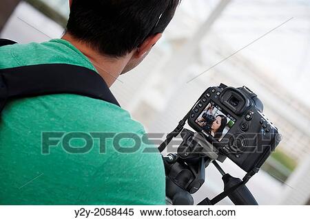 Man with camera and woman with camera, Valencia, Spain View Large Photo Image Stock Photography - Man with camera and woman with camera, Valencia, Spain. Fotosearch