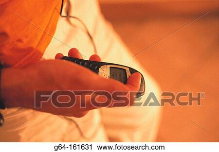 Man with cell phone View Large Photo Image Stock Image - Man with cell phone. Fotosearch
