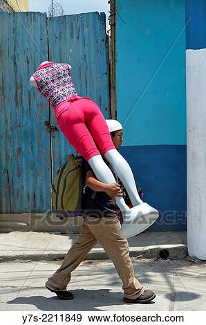 Stock Photo - Man with dummy on street in Coban, Guatemala, Central America.. Fotosearch