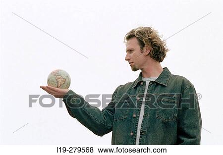 man with globe View Large Photo Image Stock Photo - man with globe. Fotosearch