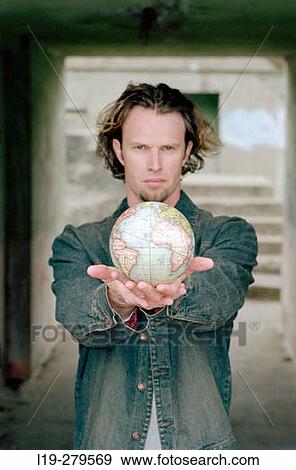 man with globe View Large Photo Image Stock Photo - man with globe. Fotosearch