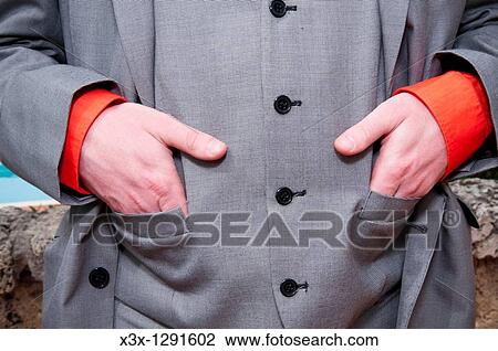 Stock Image - Man with hands in pockets. Fotosearch