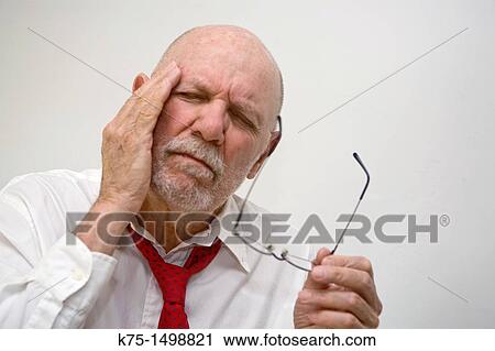 Stock Image - Man with headache. Fotosearch
