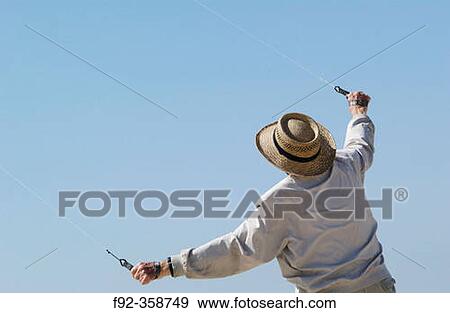 Man with kite View Large Photo Image Stock Photo - Man with kite. Fotosearch