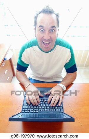 Man with laptop computer View Large Photo Image Stock Image - Man with laptop computer. Fotosearch