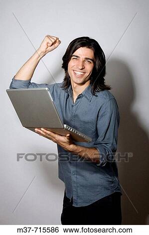 Stock Photograph - Man with laptop.. Fotosearch