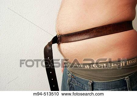 Man with low trousers and belt. View Large Photo Image Stock Image - Man with low trousers and belt.. Fotosearch