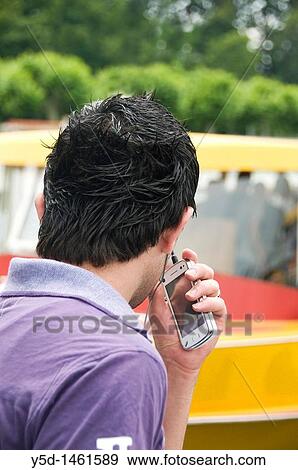man with mobile phone, black hair, Geneva, Switzerland View Large Photo Image Stock Photo - man with mobile phone, black hair, Geneva, Switzerland. Fotosearch