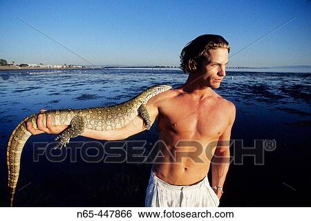 Man with Monitor Lizard View Large Photo Image Stock Photograph - Man with Monitor Lizard. Fotosearch