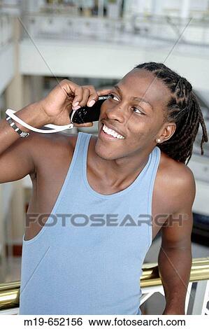 Man with MP player View Large Photo Image Stock Photograph - Man with MP player. Fotosearch