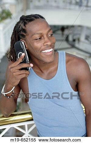 Man with MP player View Large Photo Image Stock Photography - Man with MP player. Fotosearch