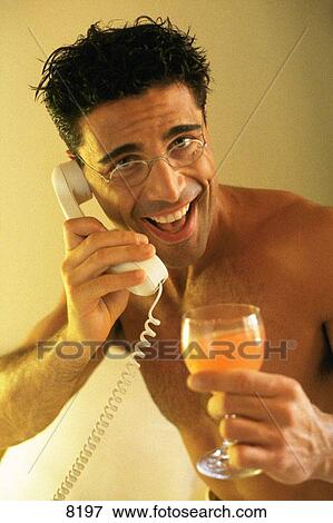 Man with orange juice and phone View Large Photo Image Stock Photo - Man with orange juice and phone. Fotosearch