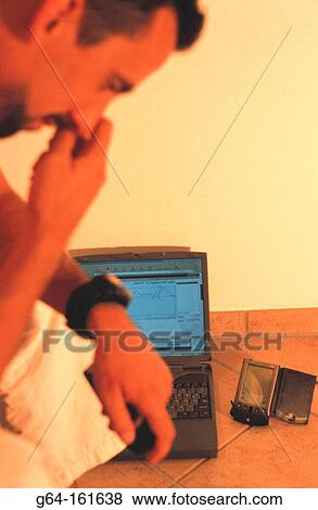 Man with palm pilot and laptop computer View Large Photo Image Stock Photo - Man with palm pilot and laptop computer. Fotosearch