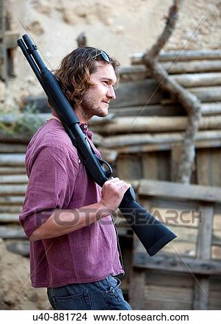 Man with sawed off shotgun View Large Photo Image Picture - Man with sawed off shotgun. Fotosearch